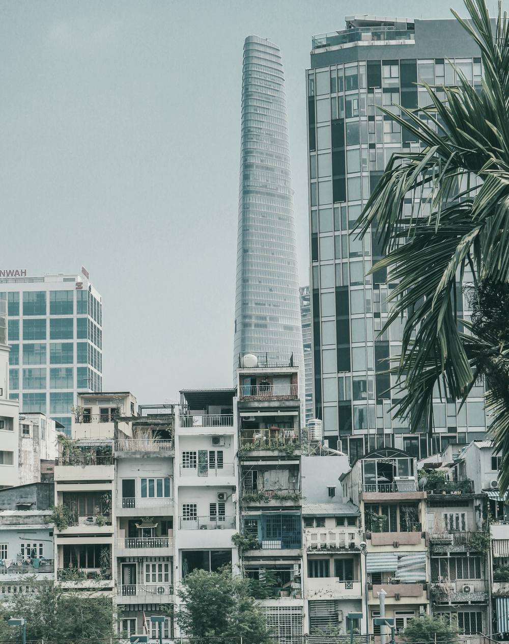 Dense low-rise housing below office towers, District 1, Ho Chi Minh City